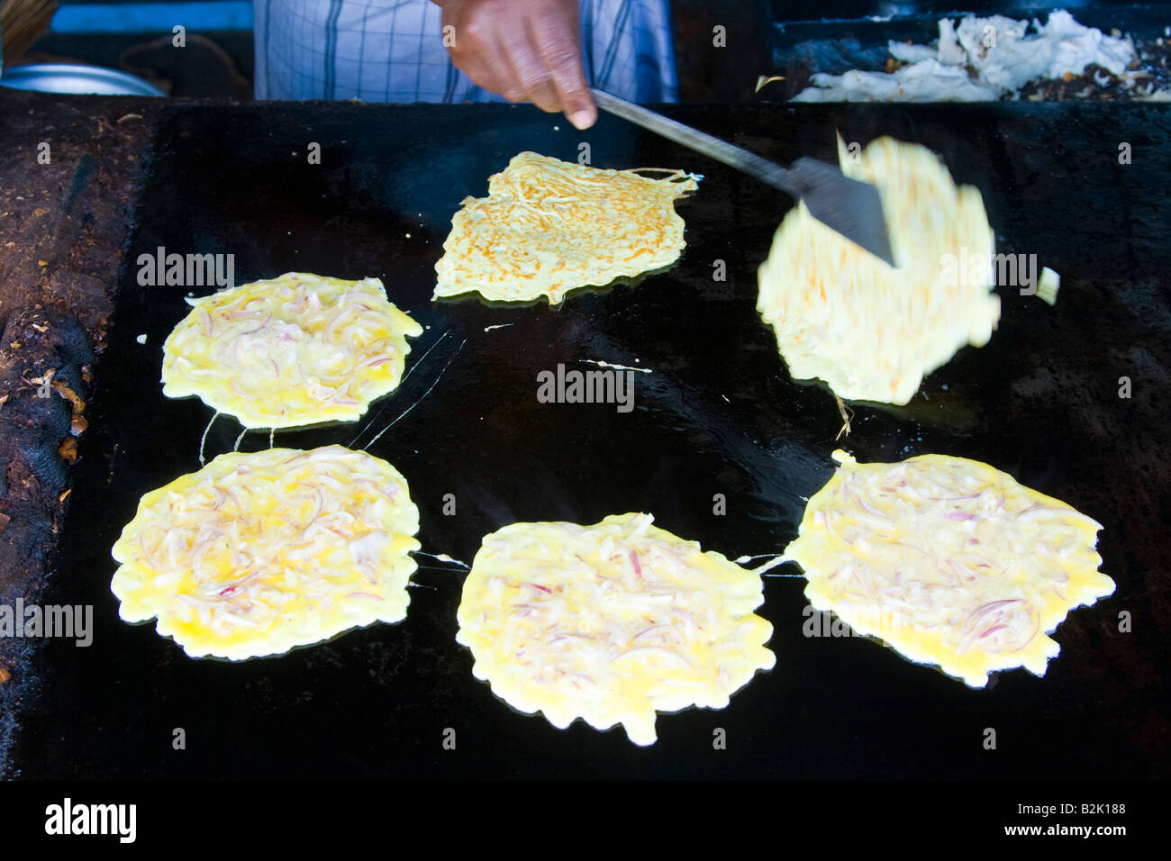 Street Vendor Frying Omlettes in Darasuram South India Stock Photo