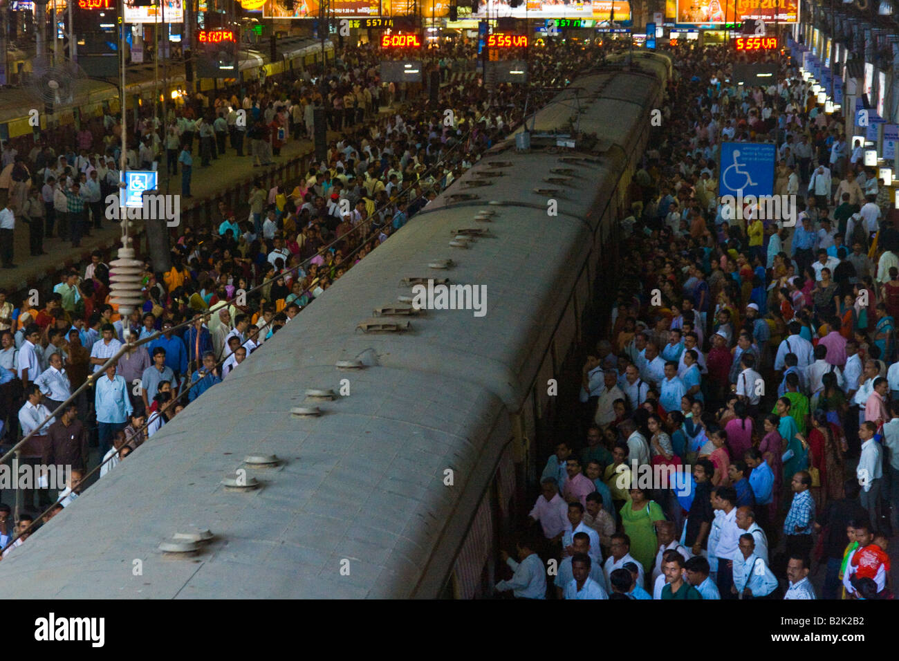 Crowded Train Platform in Chhatrapati Shivaji Train Station in Mumbai India Stock Photo