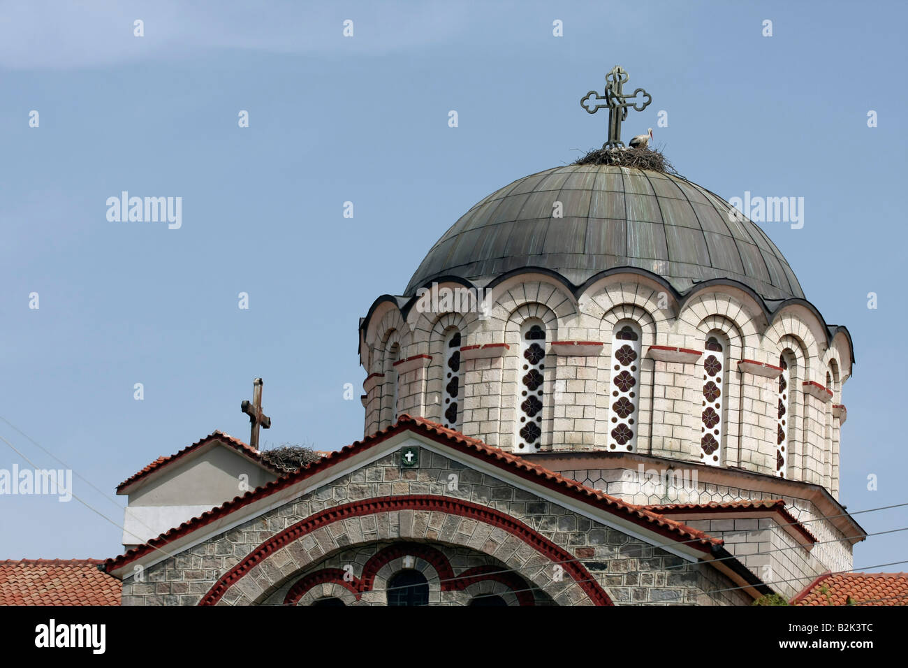 Greece Central Greece Macedonia Edessa the roof of the Cathedral A stark can be seen nesting by the crusafix Stock Photo