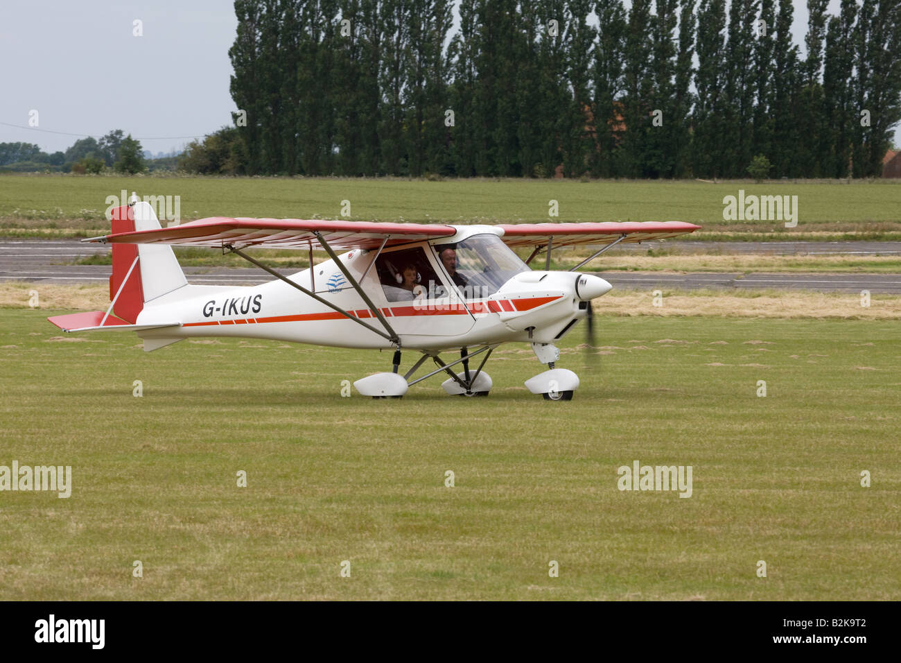 Ikarus C42 FB UK G-IKUS taxiing after landing at Wickenby Airfield Stock Photo