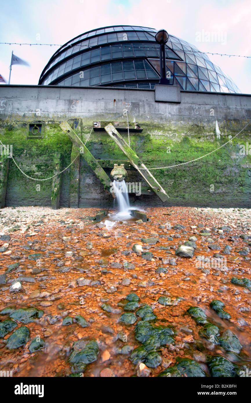 Thames river sewage overflow outlet near City Hall, London, England, UK Stock Photo
