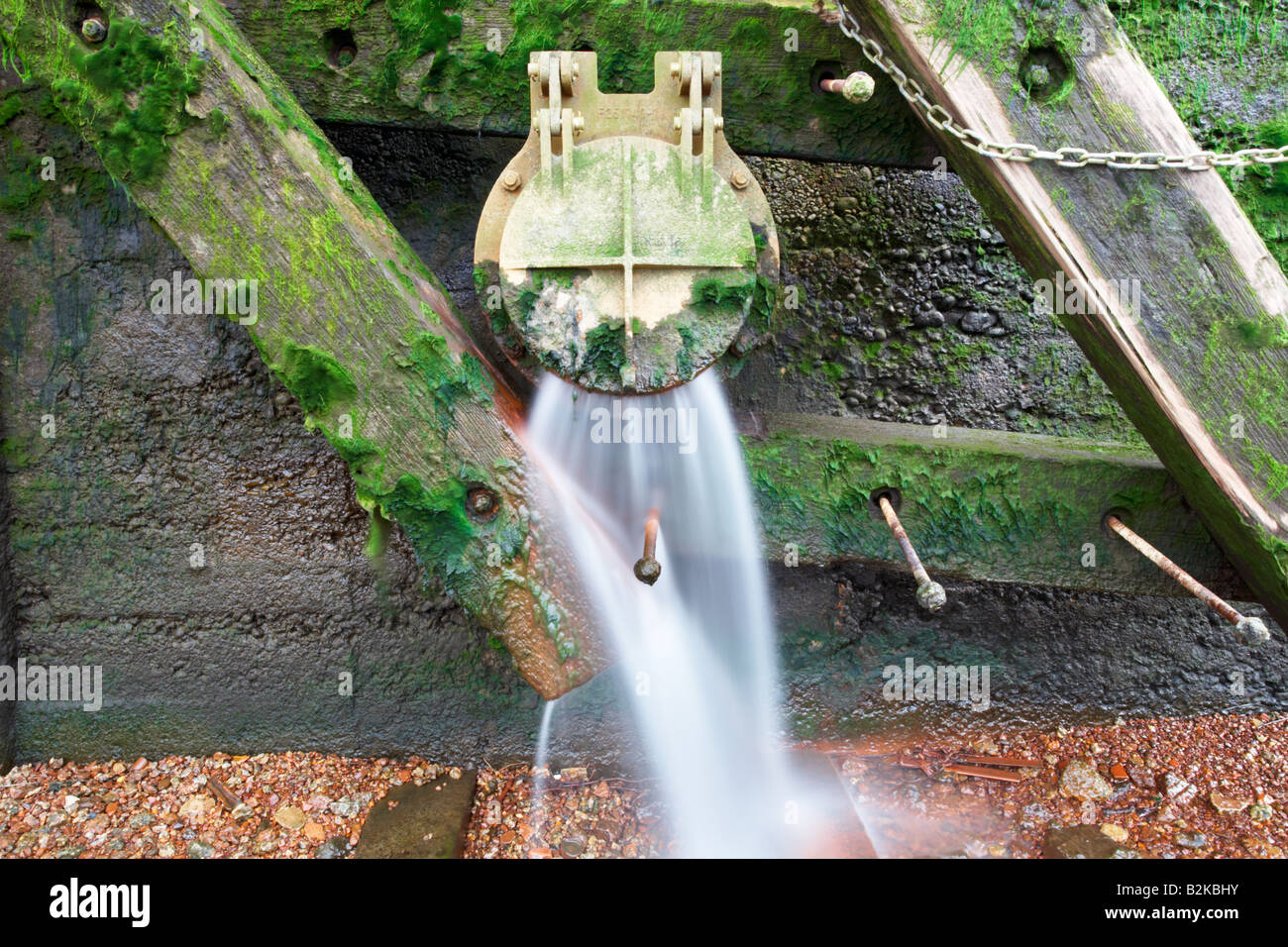 Sewage overflow outlet pouring into the river Thames, London city, England, UK. Stock Photo