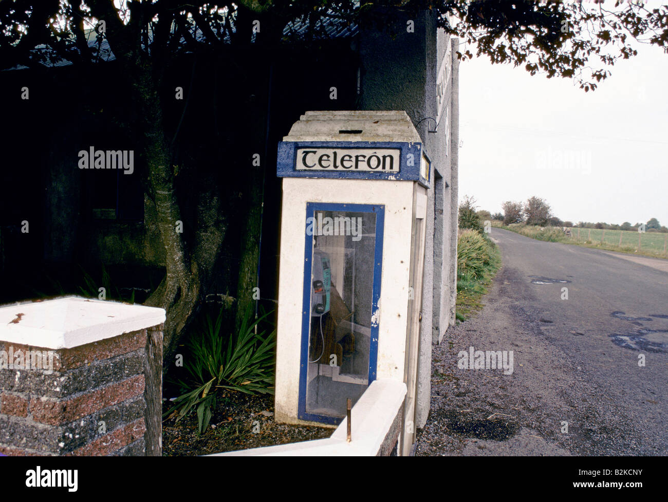 RURAL ROAD WITH TELEPHONE BOX CO GALWAY EIRE 1992 Stock Photo