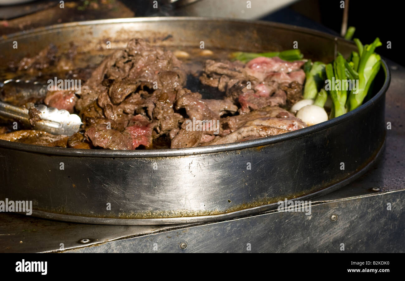 Carne asada beef cooking at an outdoor festival Stock Photo