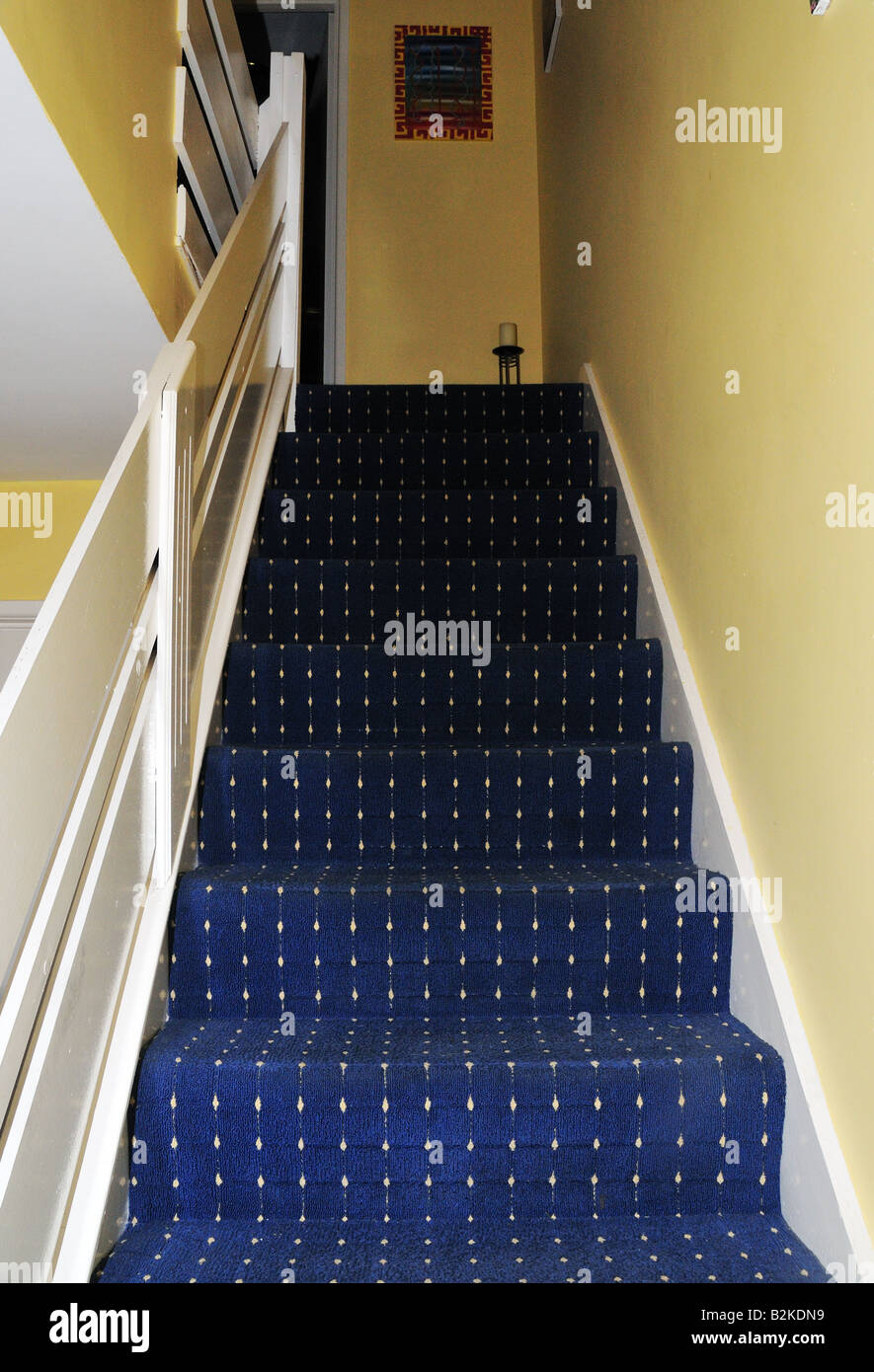 Carpeted stairs in a hallway Stock Photo