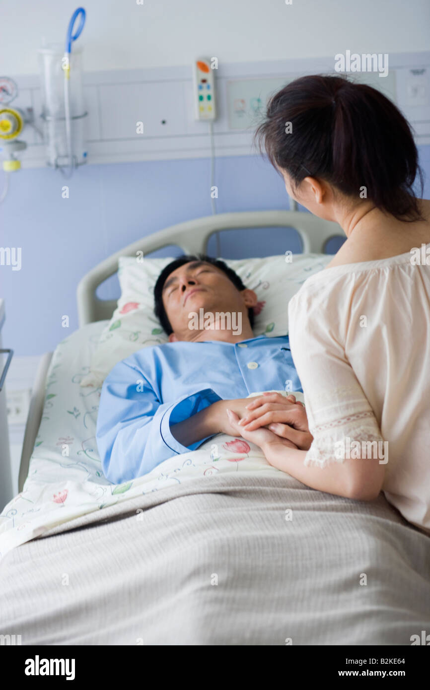 Woman in hospital bed rear hi-res stock photography and images - Alamy