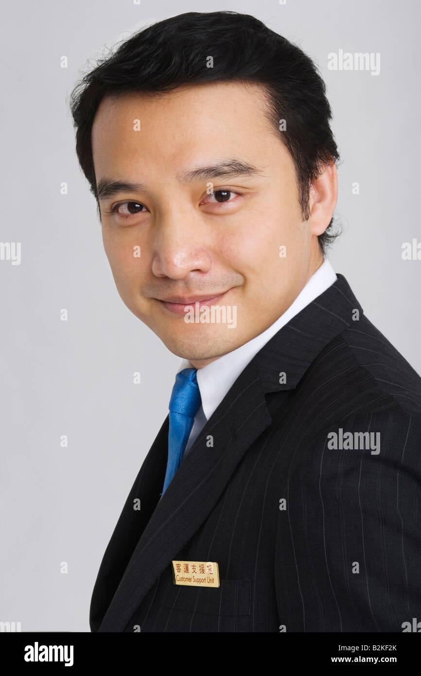 Portrait of a businessman smiling Stock Photo - Alamy