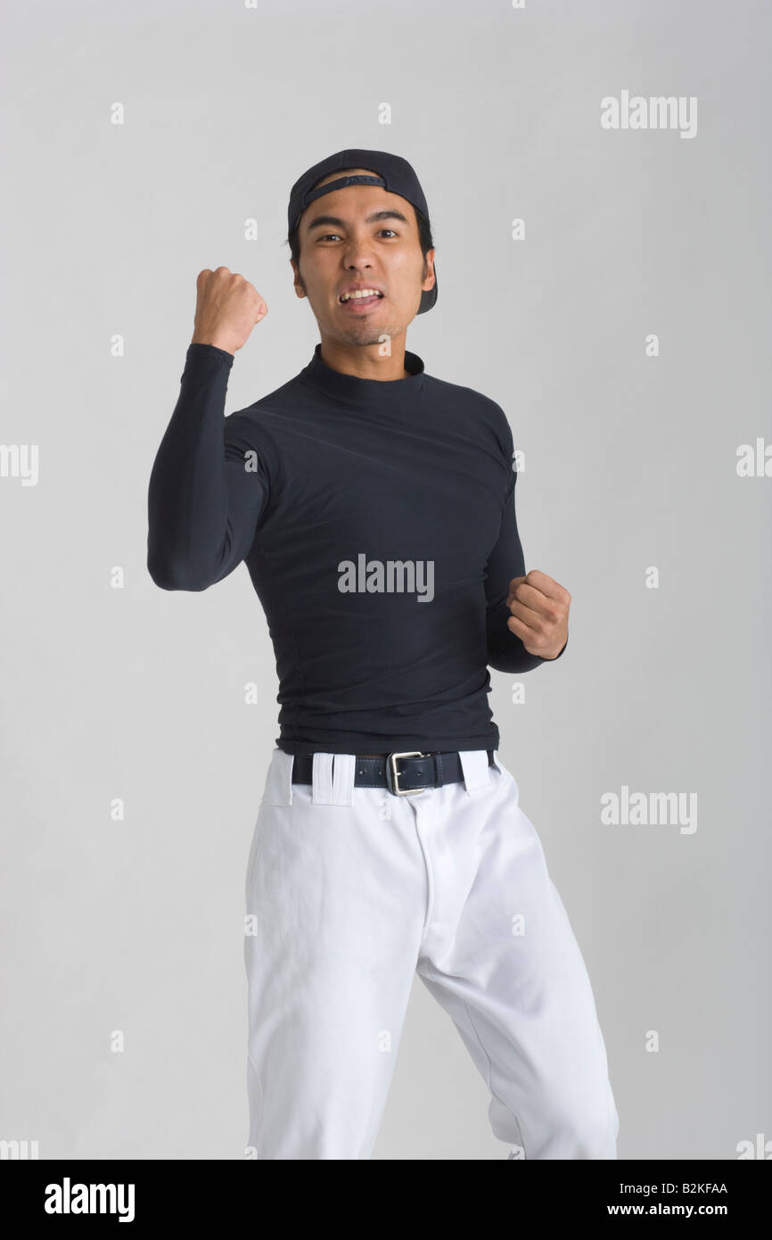 Portrait of a young man standing and making a face Stock Photo