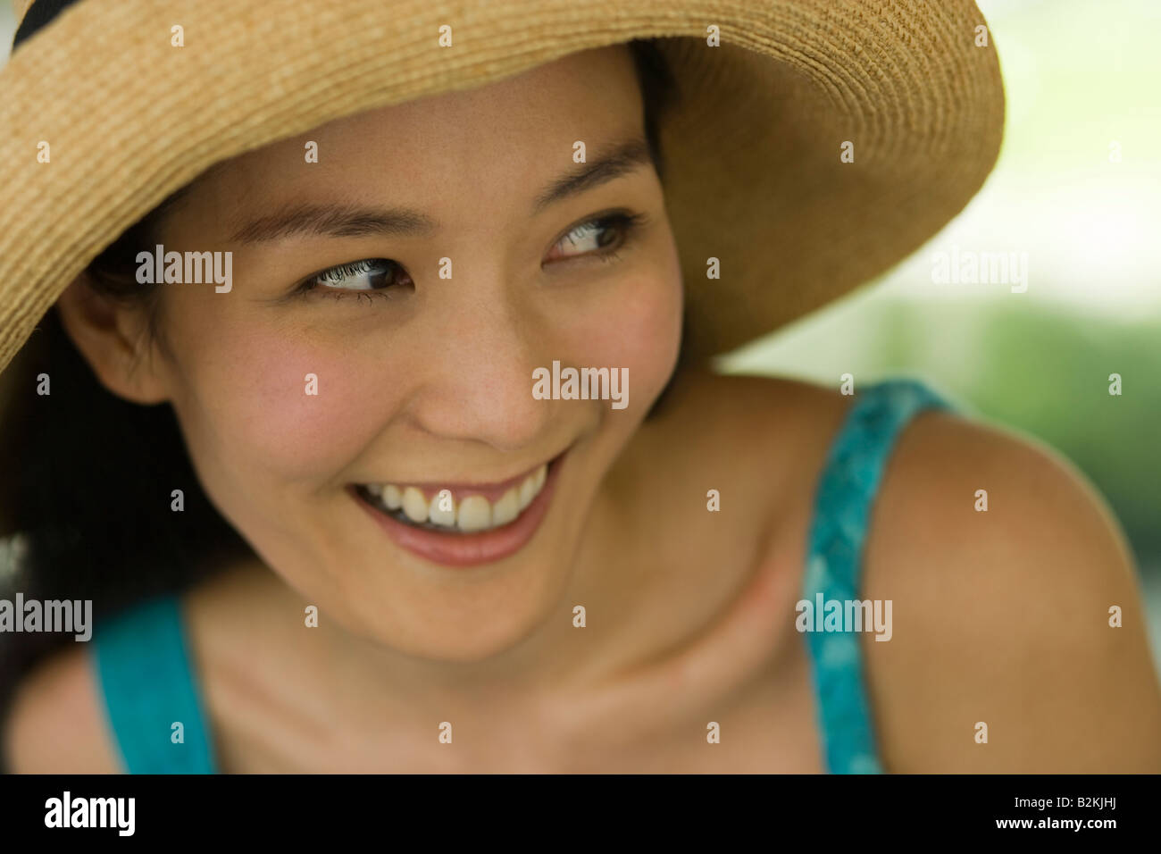 Close-up of a young woman smiling Stock Photo - Alamy
