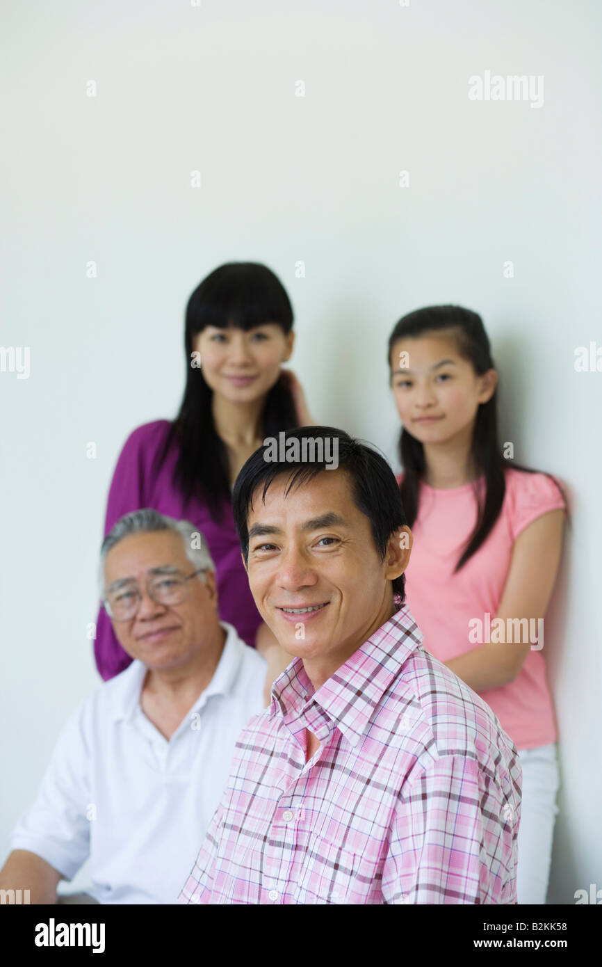 Portrait of a mid adult man smiling with his family Stock Photo - Alamy