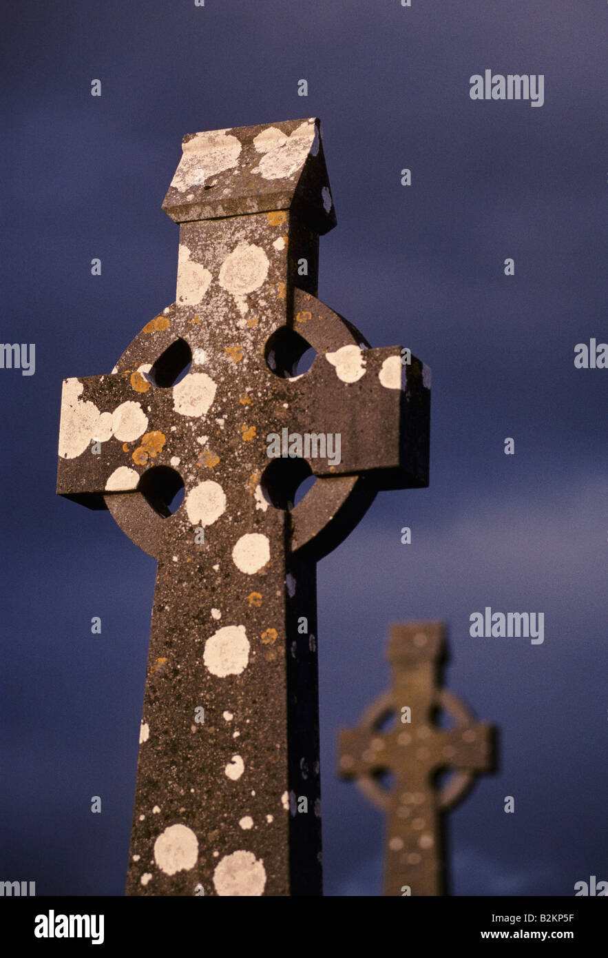 GALWAY CITY WEATHERED GRAVE STONES CARVED INTO THE CELTIC CROSS IN KILCOLAN CEMETRY JUST OUTSIDE GALWAY CITY Stock Photo