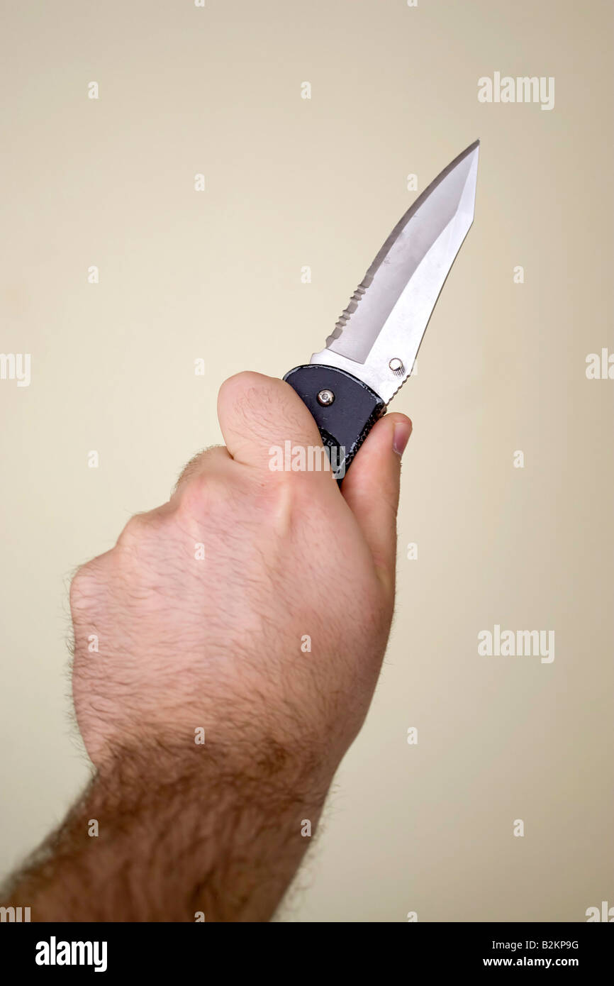 Hand wielding a knife hires stock photography and images Alamy