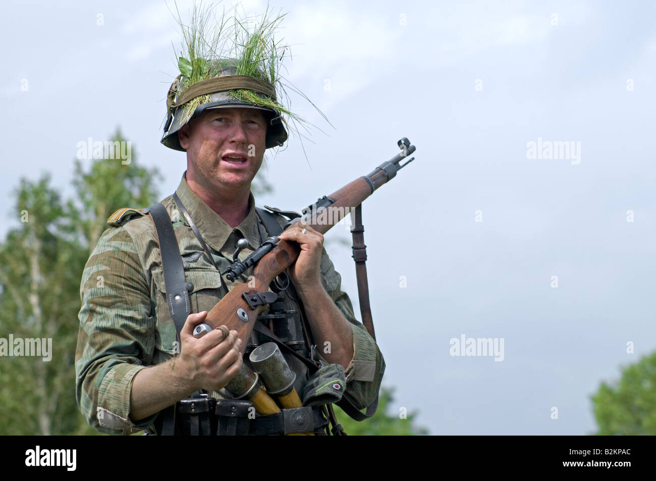 A German army Unteroffizier giving ad hoc training for field tactics to new troops Stock Photo