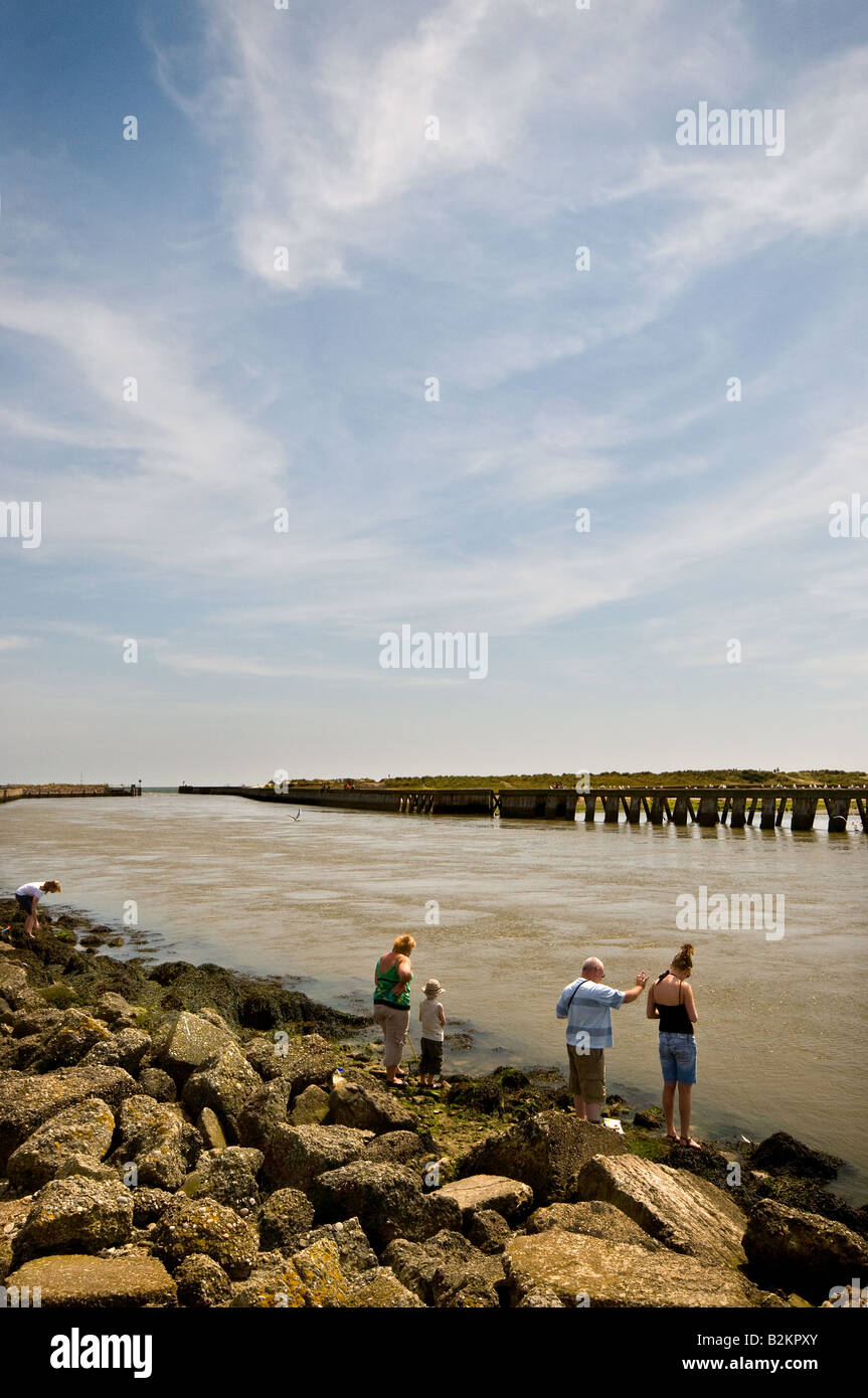 Holidaymakers crabbing on the River Blythe at Southwold in Suffolk. Stock Photo