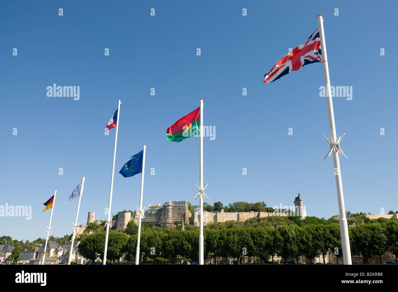 Display of European flags and view of the Royal Fortress of Chinon, France. Stock Photo