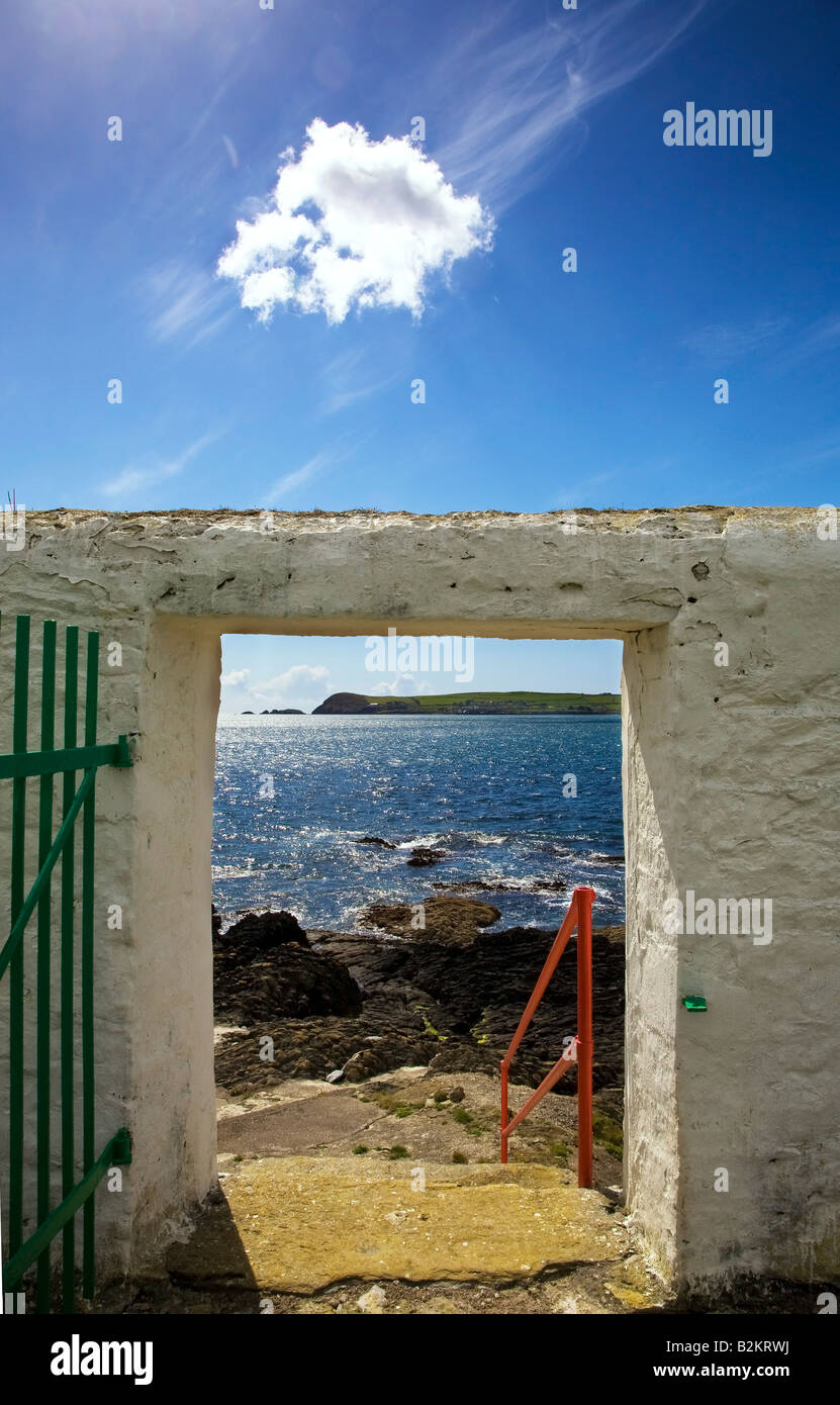 Doorway near Ballynacourty Lighthouse, With View to Helvick Head, County Waterford, Ireland Stock Photo