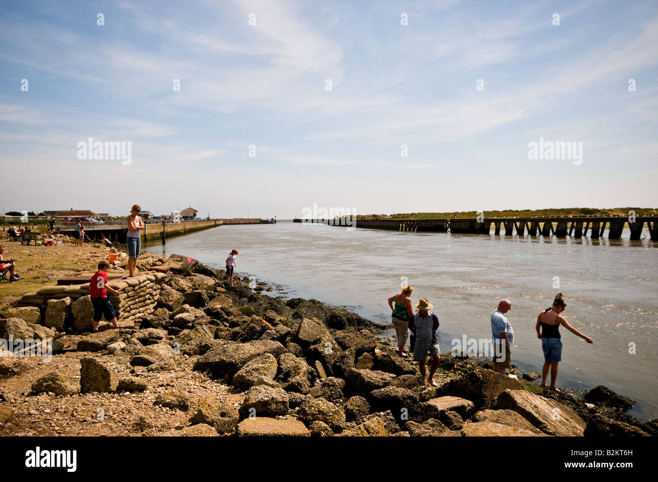 Holidaymakers crabbing on the River Blythe at Southwold in Suffolk. Stock Photo