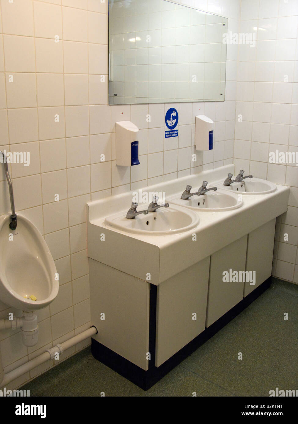 Wash basins in a Gents toilet in England UK Stock Photo Alamy