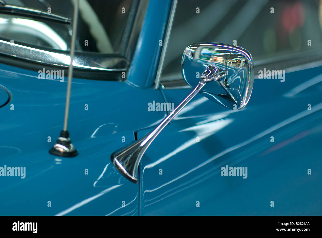 Side mirror of blue classic Mercedes Benz 190 SL Stock Photo
