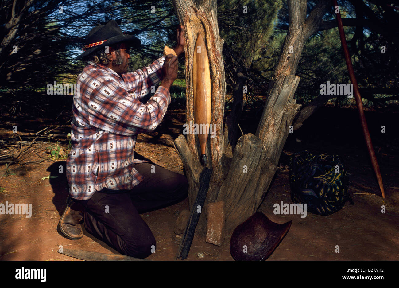 Carving spear thrower, outback Australia Stock Photo