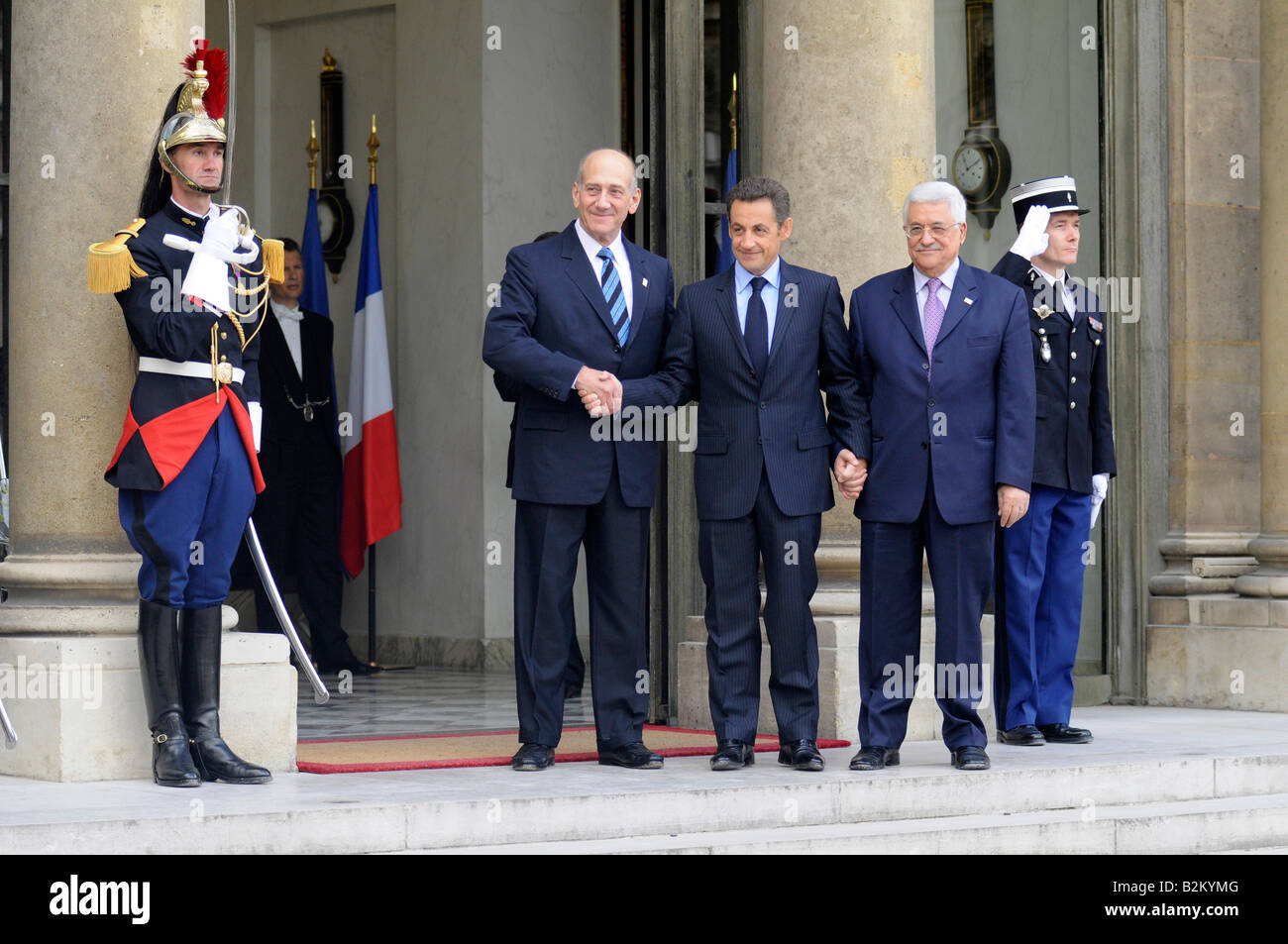 French president Nicolas Sarkozy shaking hands with Israeli PM Ehud Olmert and Palestinian authority president Mahmoud Abbas. Stock Photo