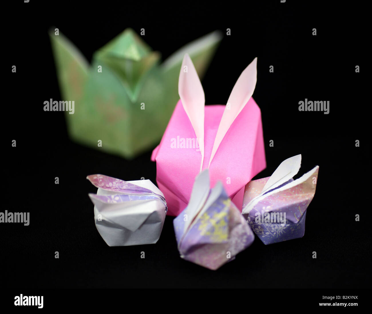 Origami crow attacking rabbits Stock Photo - Alamy