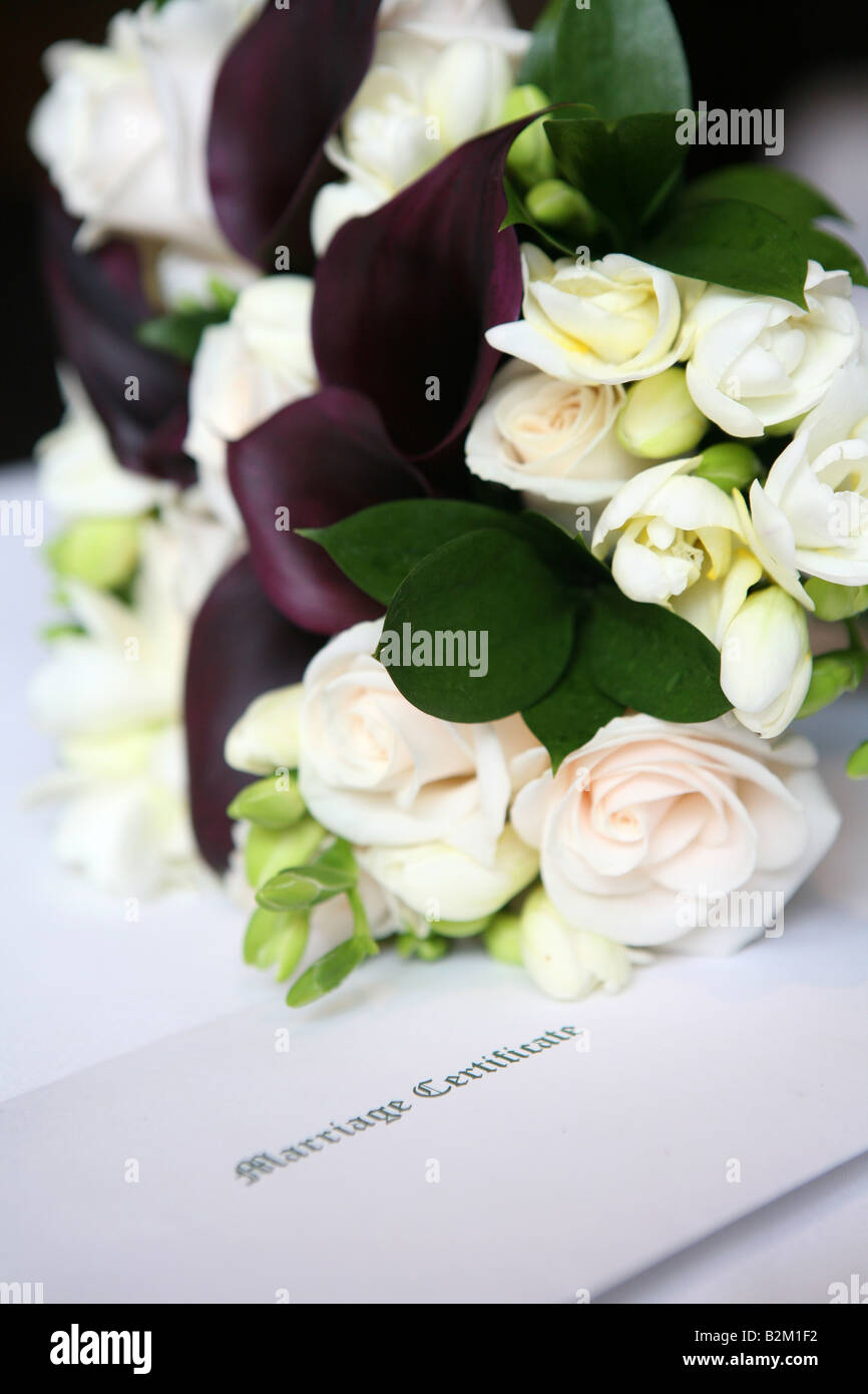 marriage certificate and wedding flowers Stock Photo