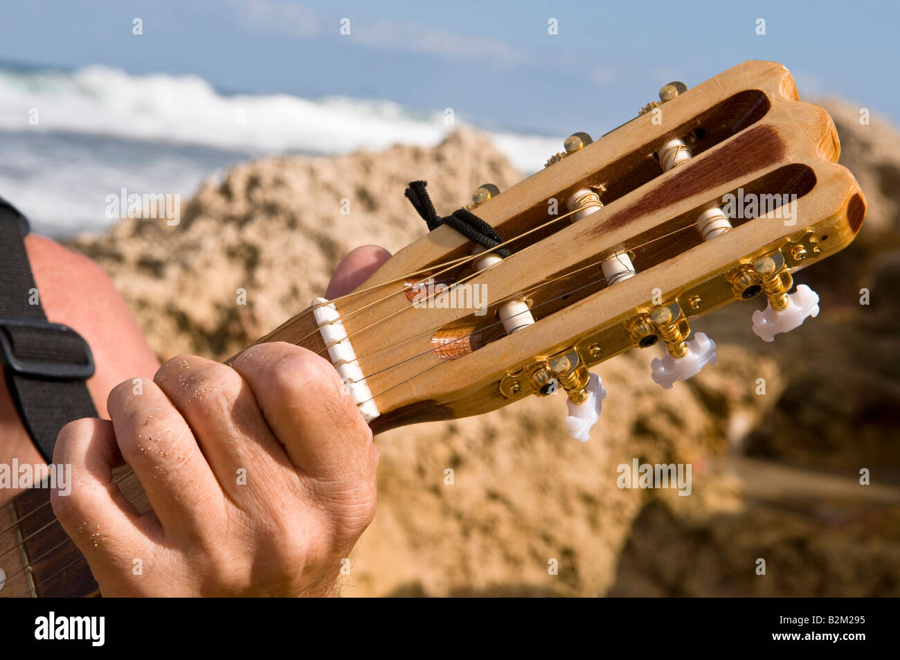 Guitar neck against the backdrop of the sea Stock Photo