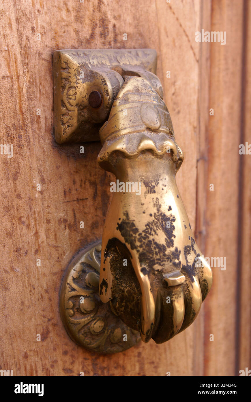 Antique door knocker on old Mexican front door Stock Photo Alamy