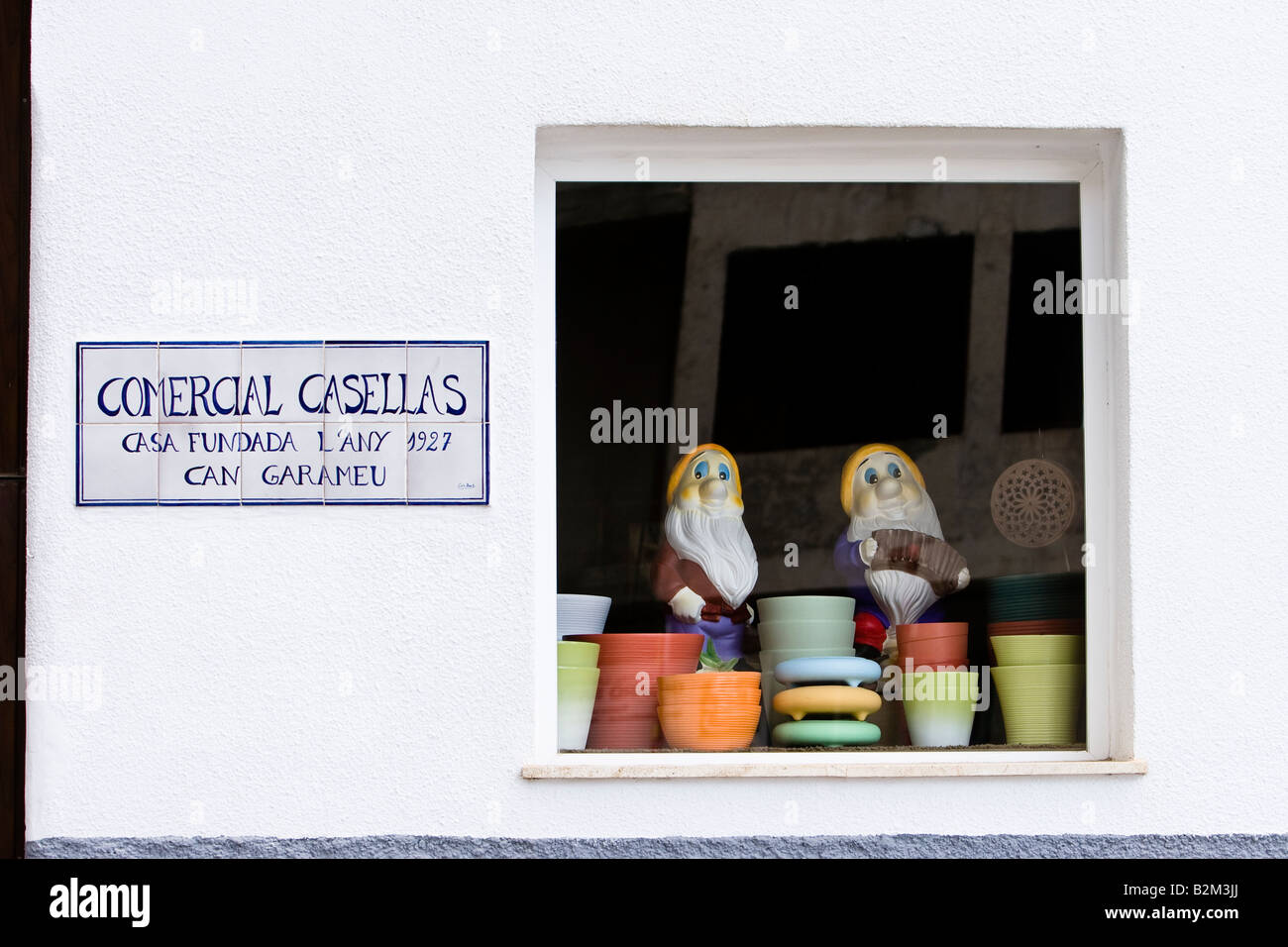 Two garden gnomes are seen in a shop window in Arna, Majorca, Spain Stock Photo