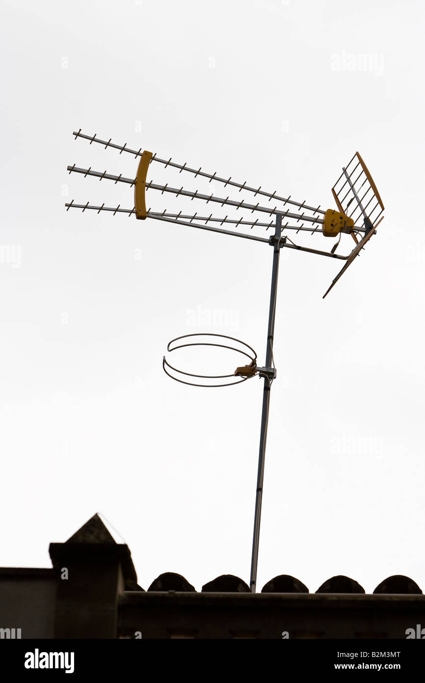 An analog television antenna is seen on a house roof in Arna, Majorca