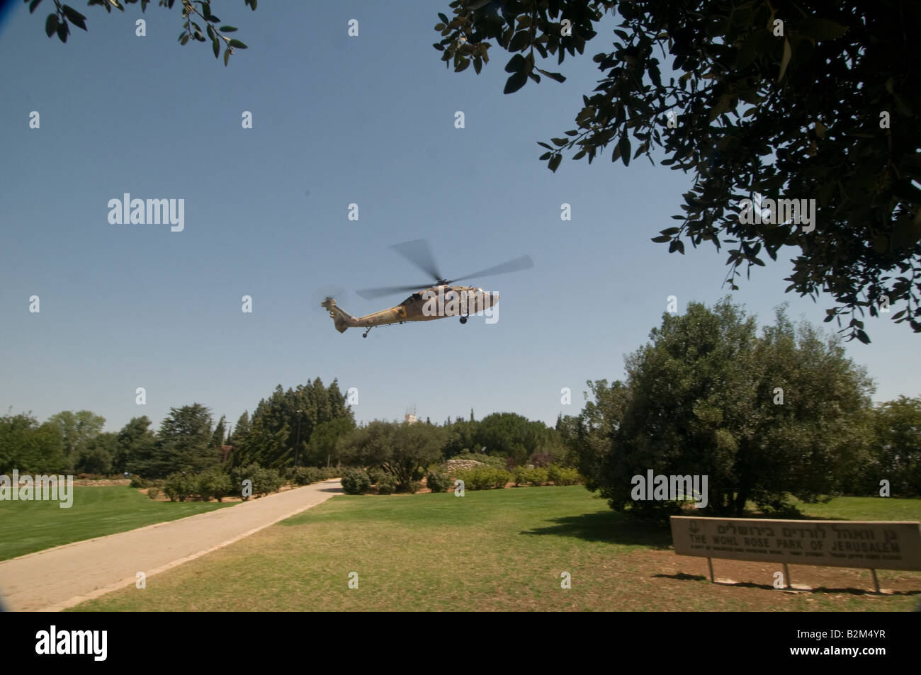 Israeli military helicopter landing on the Knesset landing pod in the Wohl rose garden' Jerusalem Stock Photo