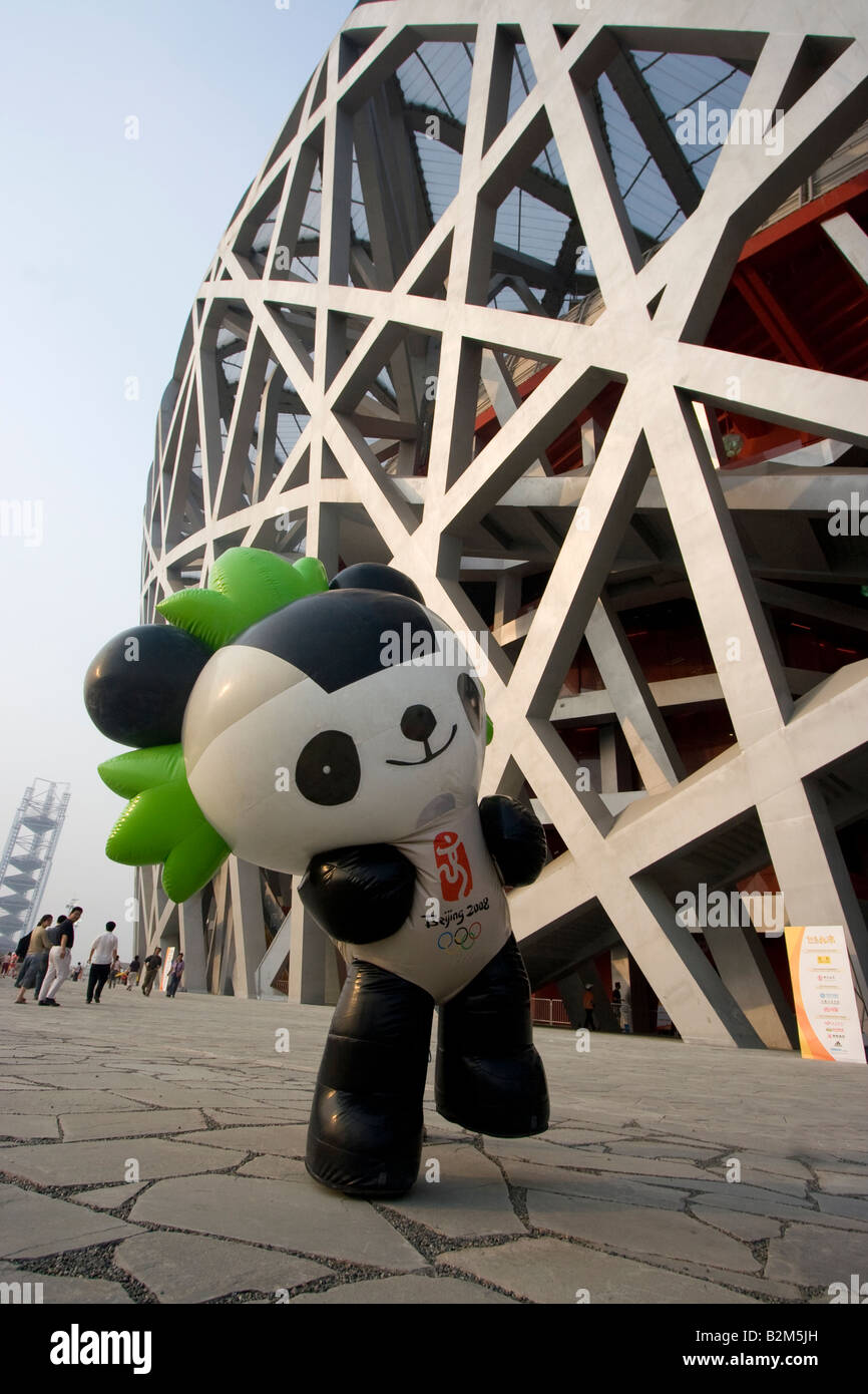 Jingjing Olympic mascot poses in front of the Bird s Nest Beijing National Stadium. Stock Photo