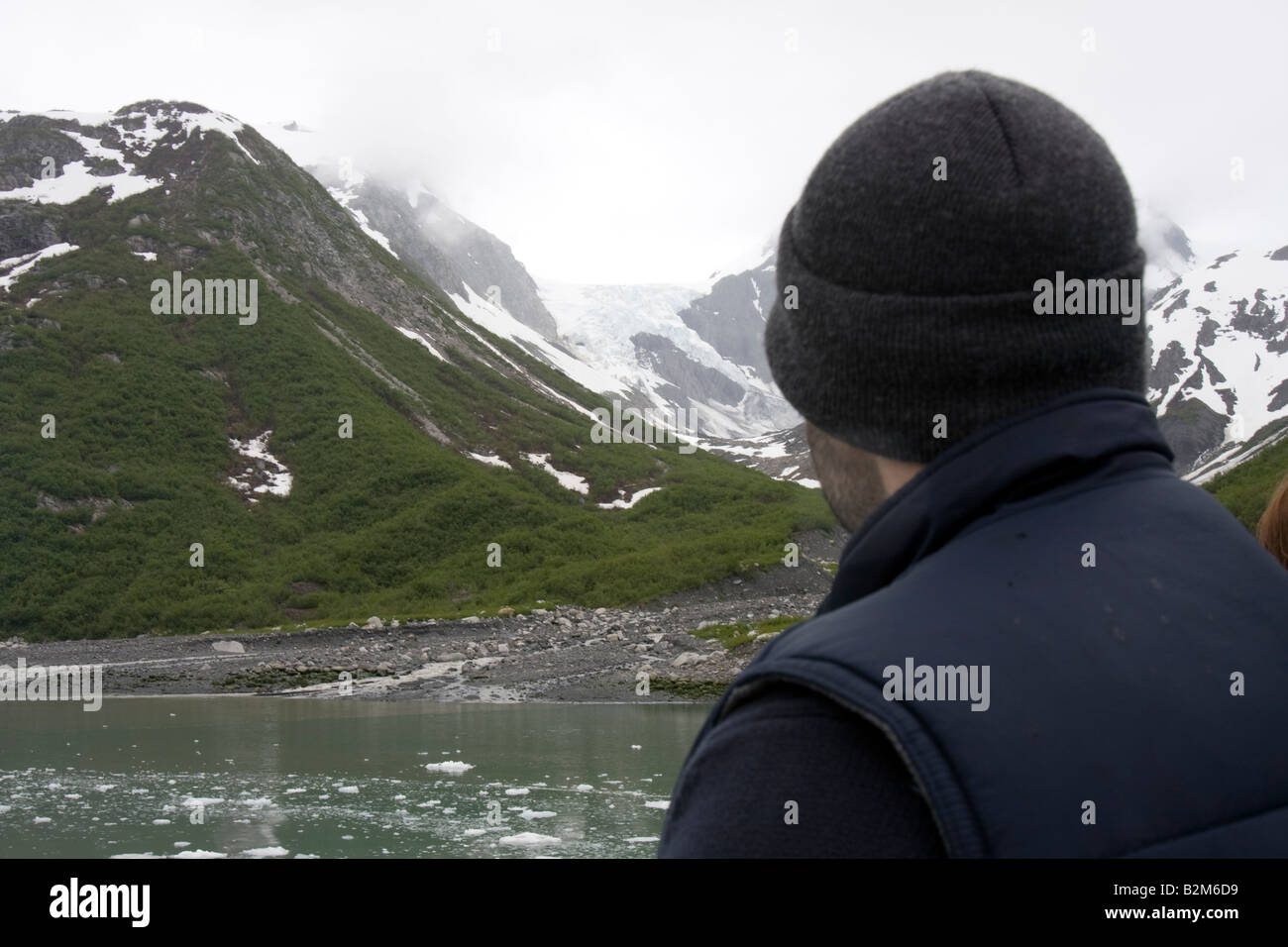 Tourist taking in the view in Kenai Fjords National Park, Kenai Peninsula Alaska Stock Photo
