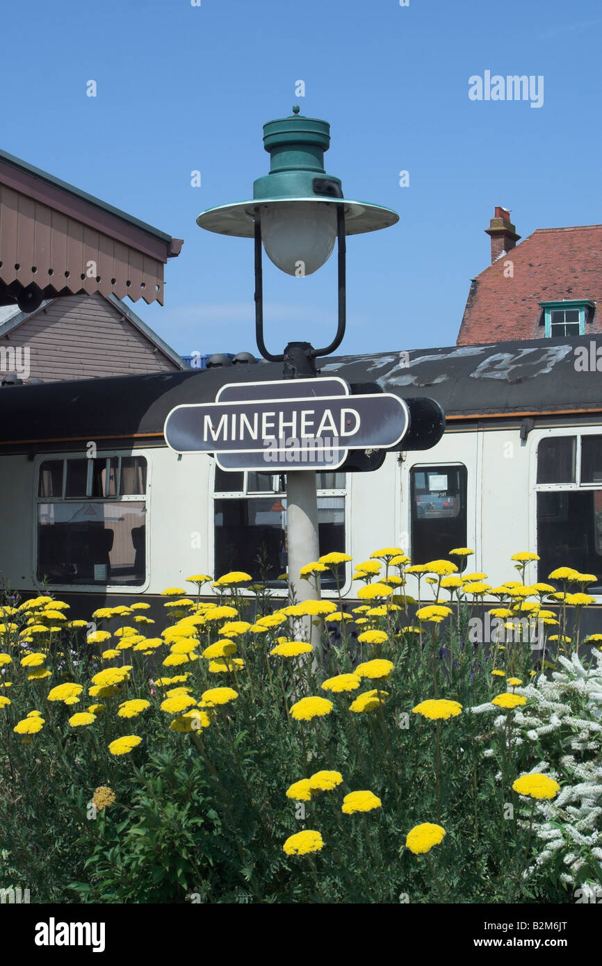 Sign and flowers at Minehead Station. West Somerset Steam Railway. Stock Photo
