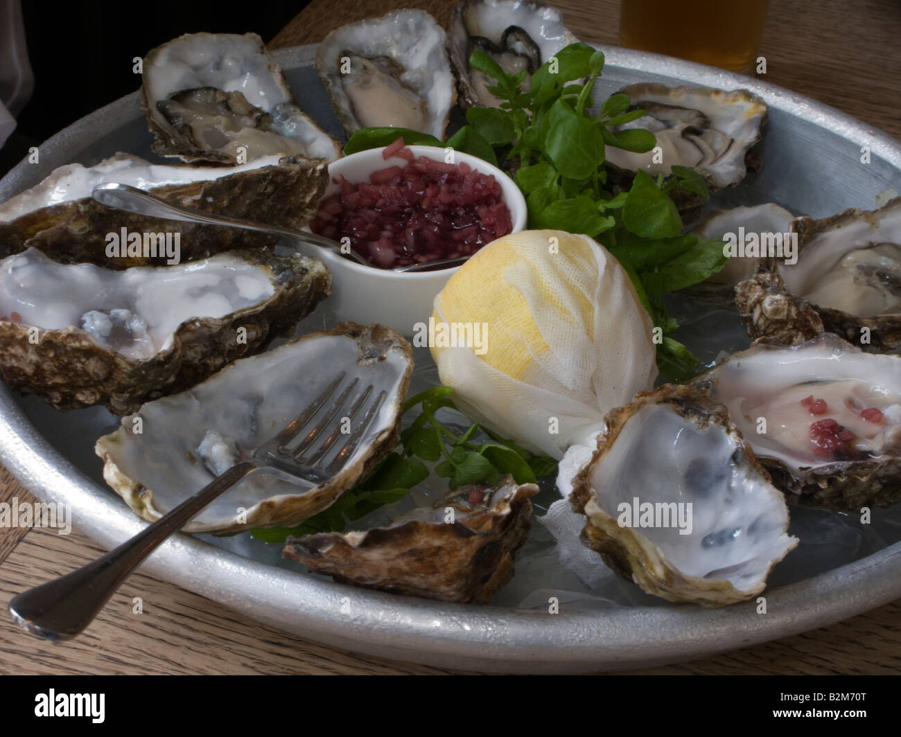 DOZEN OYSTERS HALF EATEN PLATE Stock Photo Alamy