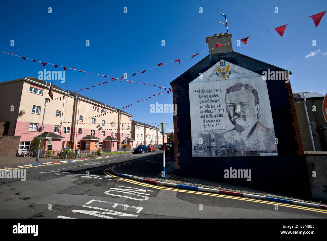 Unionist flags and murals in The Fountain district of Londonderry, County Derry, Northern Ireland Stock Photo