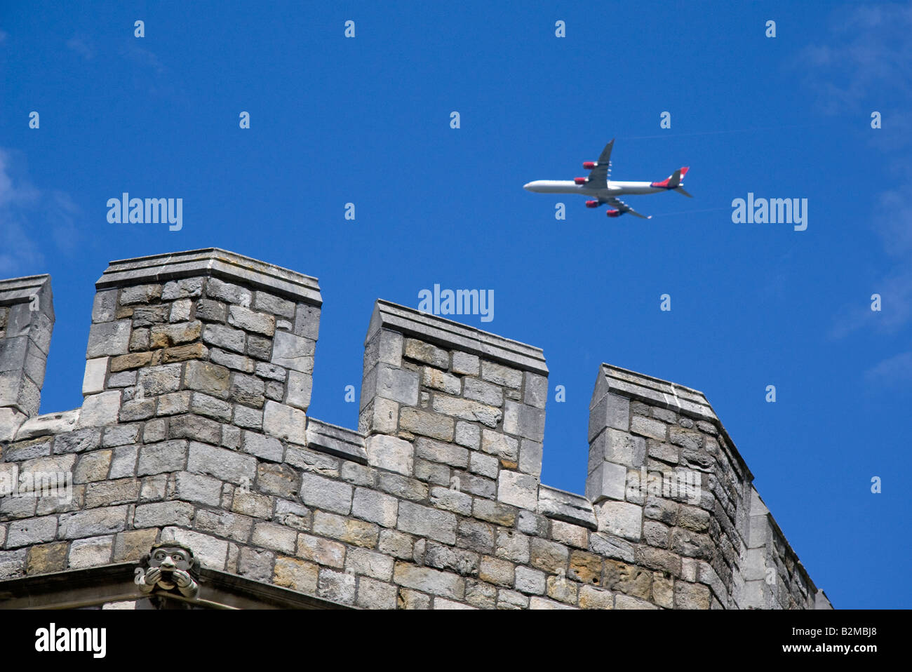 Airplane above Windsor Castle Stock Photo