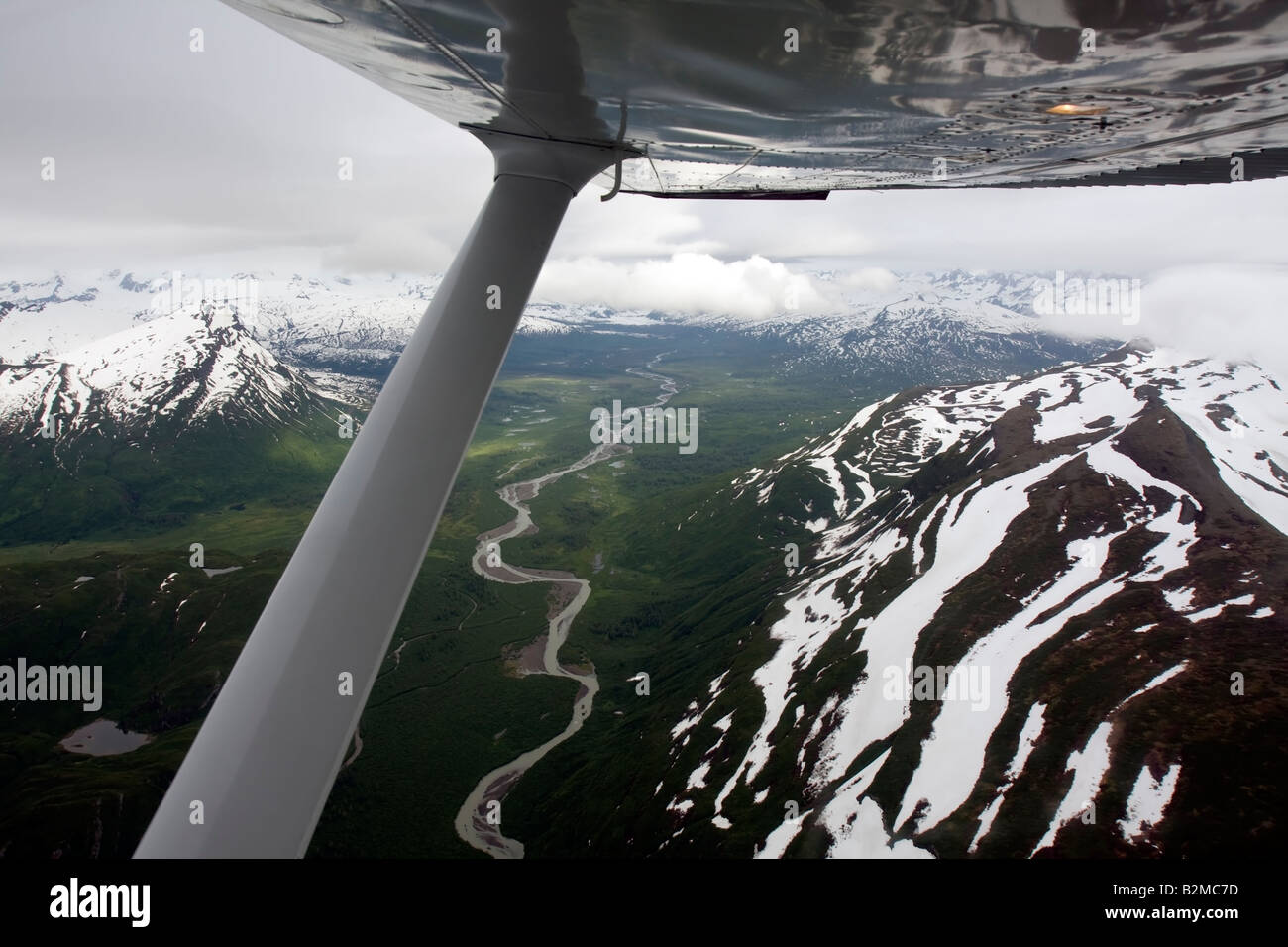 Flight seeing in a small airplane plane over Cook Inlet towards Katmai National Park and Preserve, Alaska, United States Stock Photo