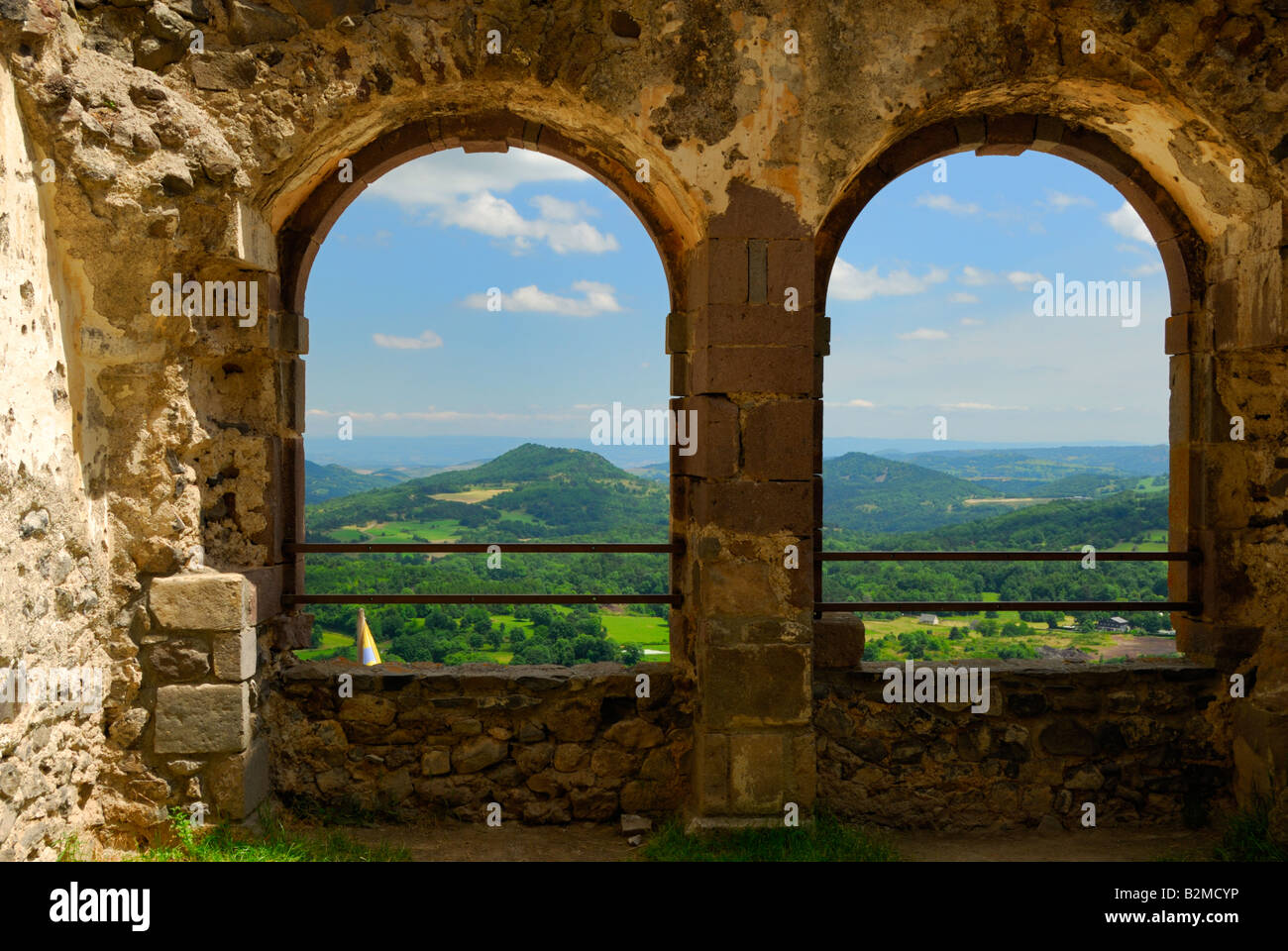 View from Chateau de Murol, Auvergne, France, framed by ruins of renaissance windows Stock Photo
