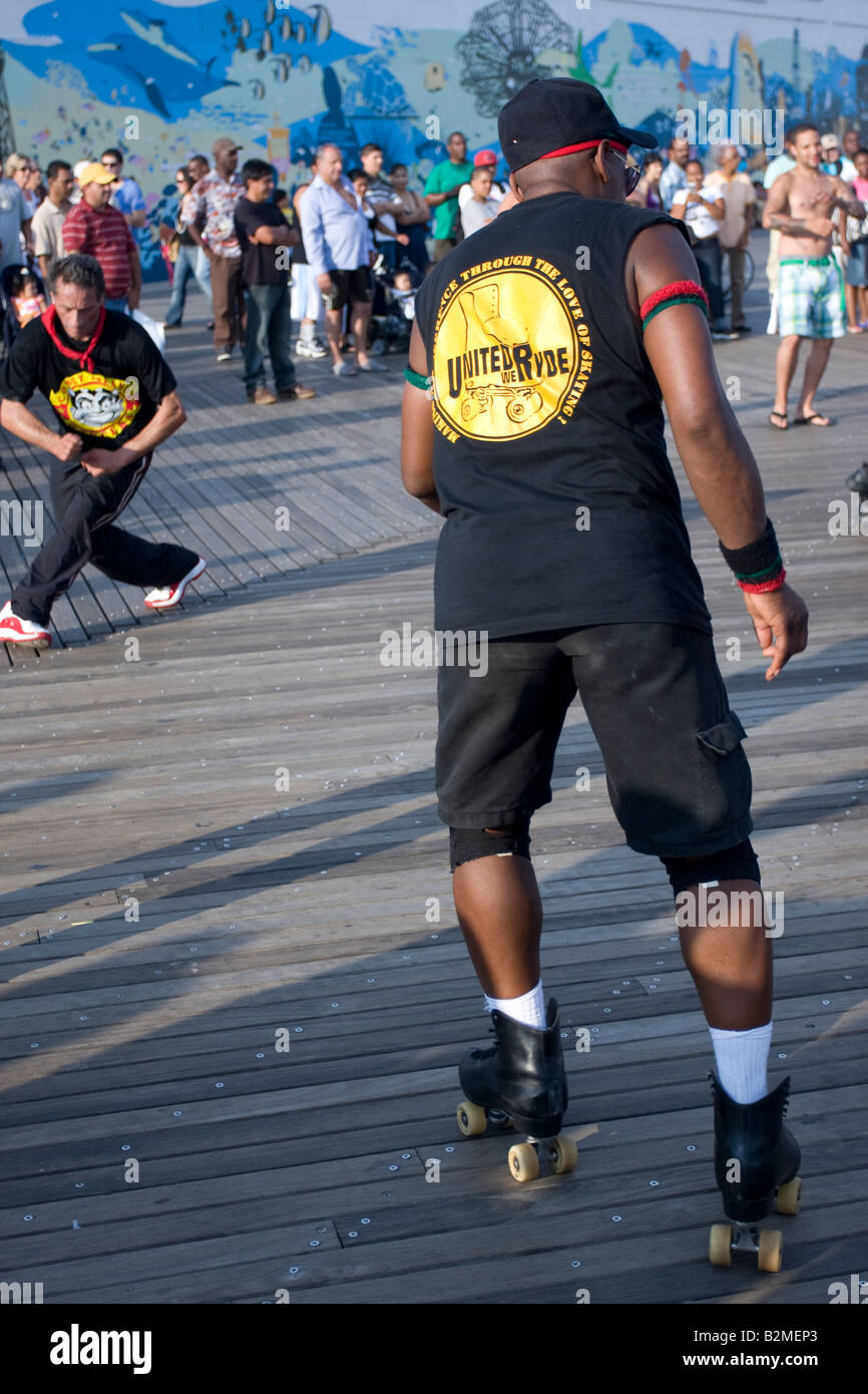 A man dancing on roller skates on the Coney Island boardwalk in