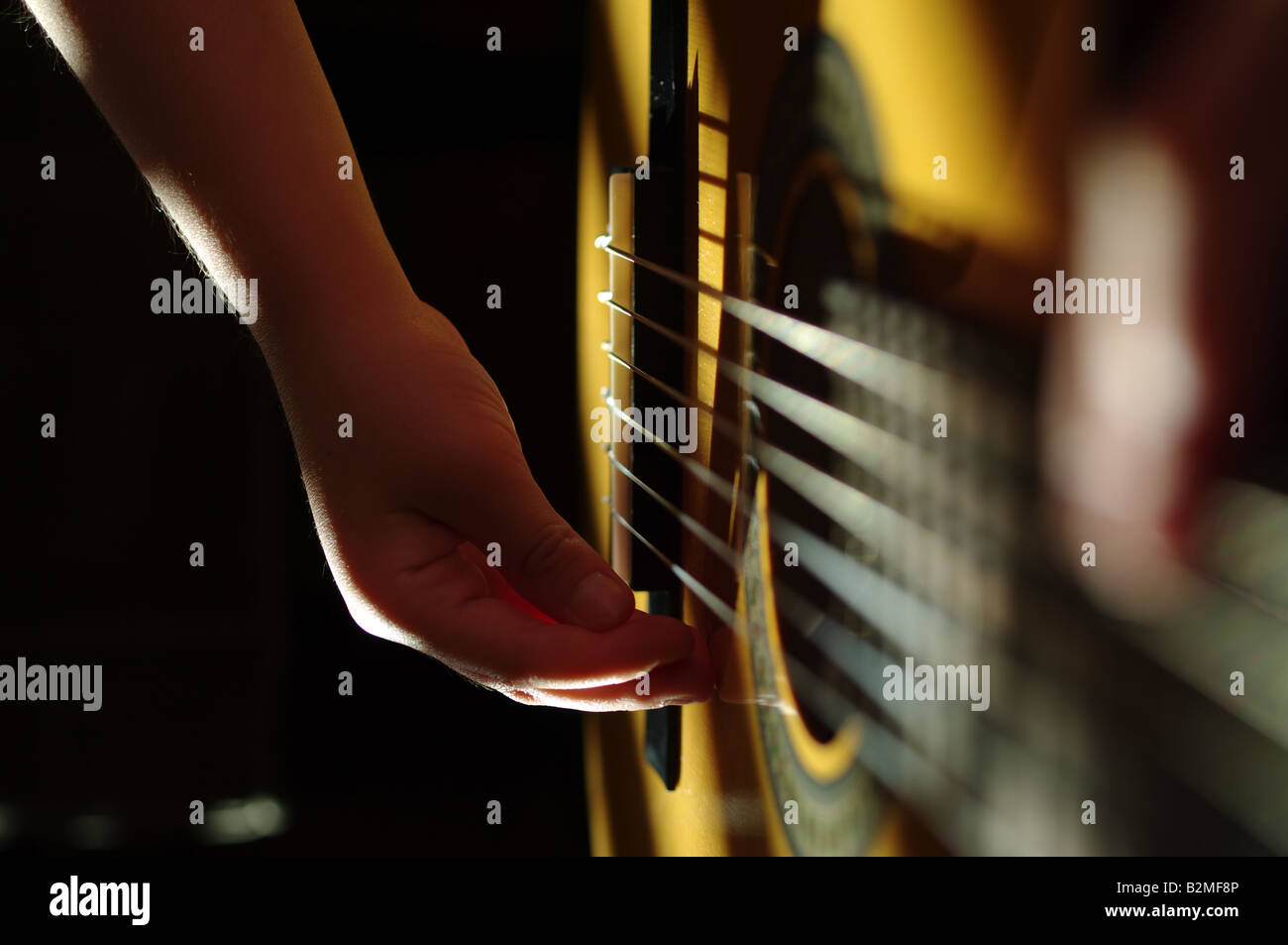 Acoustic guitar play Stock Photo - Alamy
