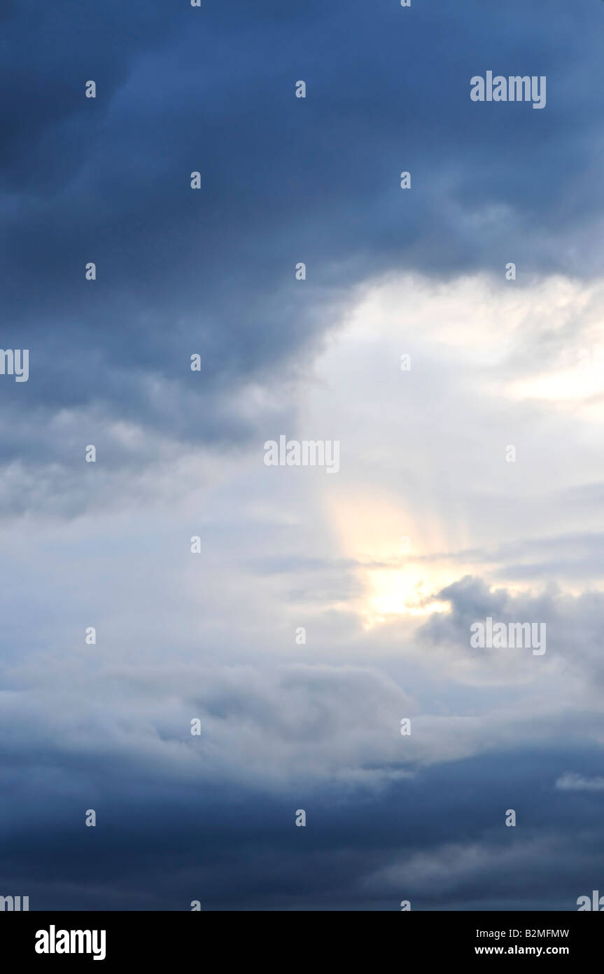 Stormy sky with sun shining through clouds Stock Photo - Alamy