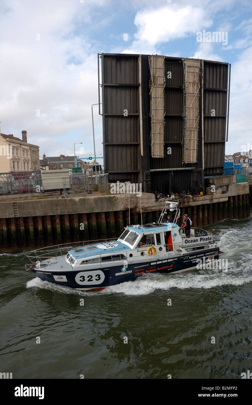 Classic offshore powerboat Ocean Pirate passing under the Bascule bridge at Lowestoft Stock Photo