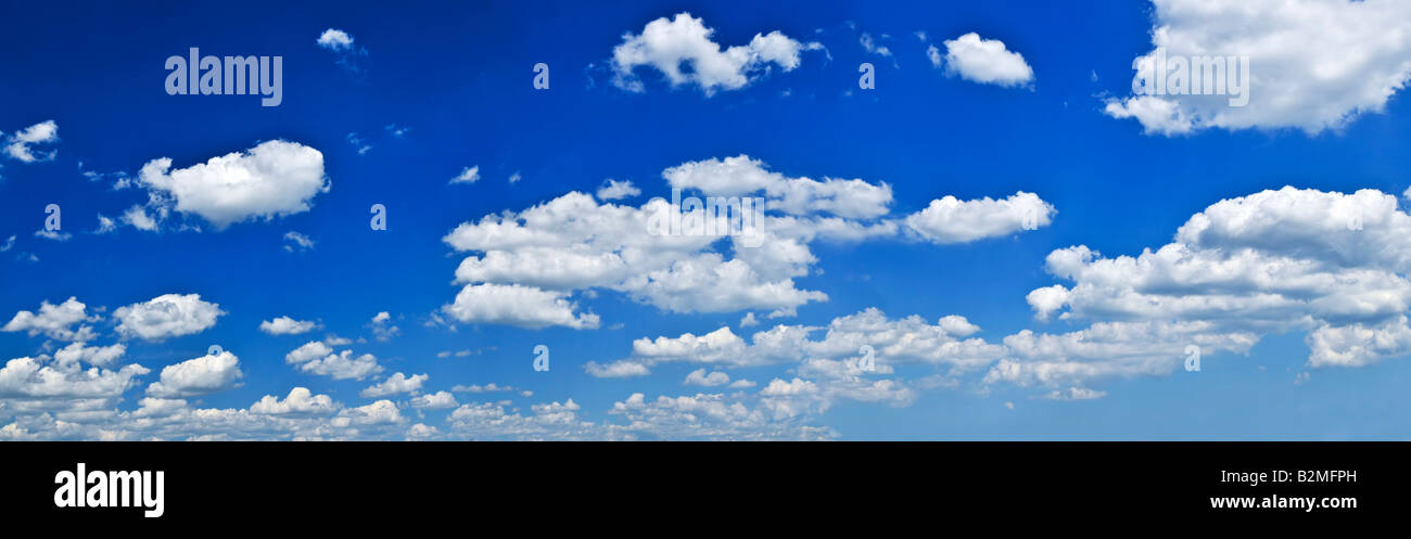 Panoramic background of blue sky with white cumulus clouds Stock Photo ...
