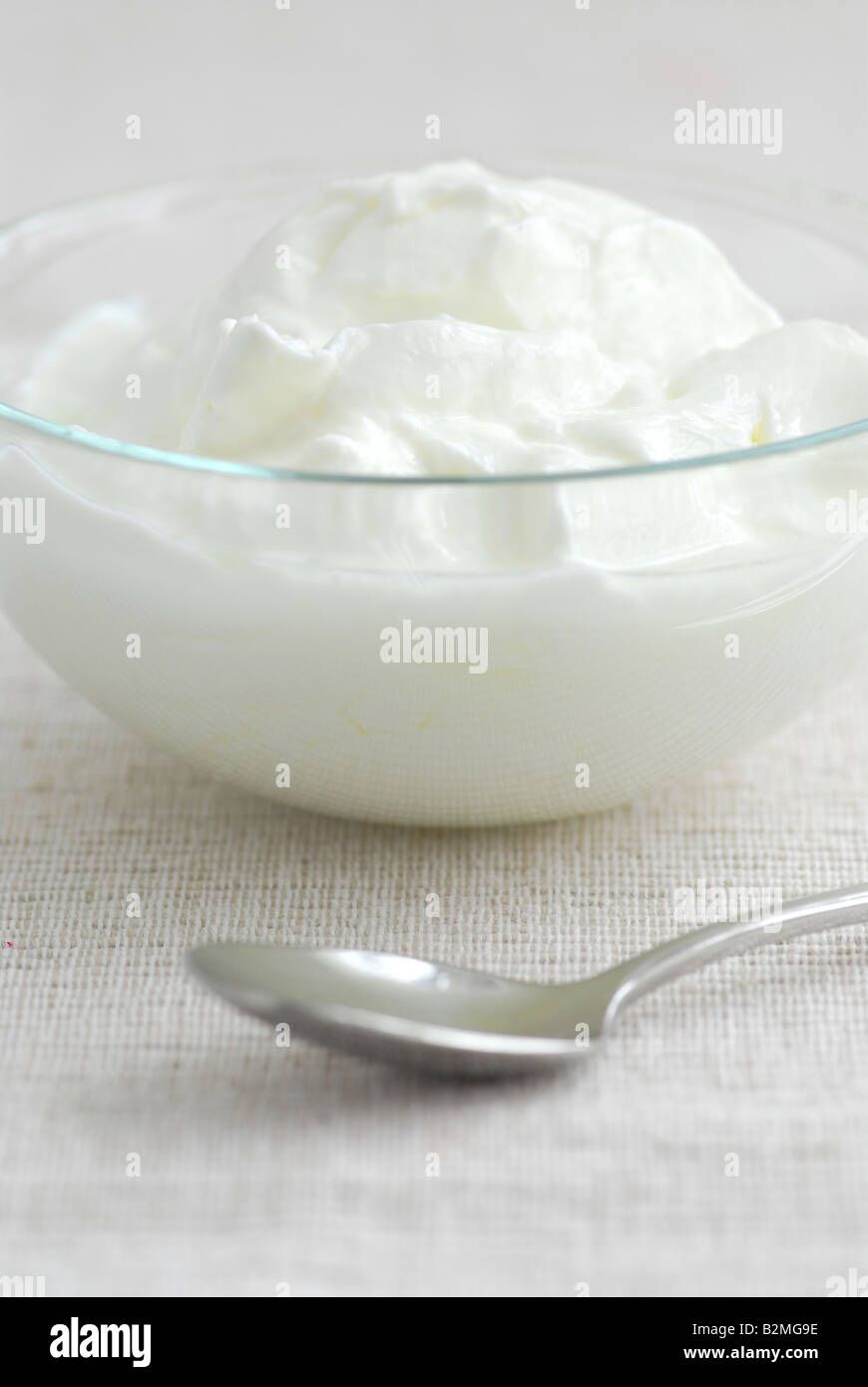 Fresh yogurt served in a clear glass bowl Stock Photo - Alamy