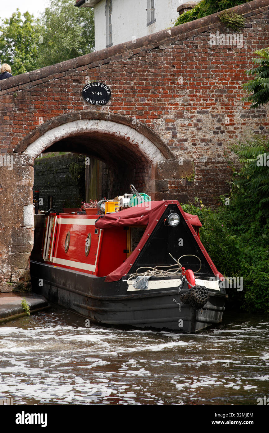 canal narrowboat exiting bridge number 46 bumble hole lock on the ...