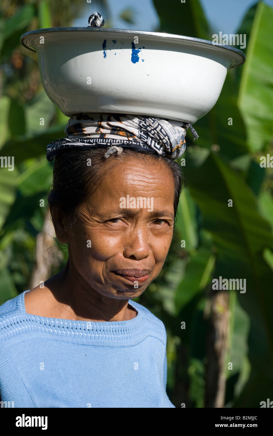 bali ubud indonesia ubud lady woman carry on head bowl white smile work