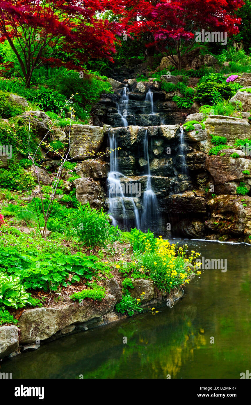Cascading waterfall and pond in japanese garden Stock Photo - Alamy
