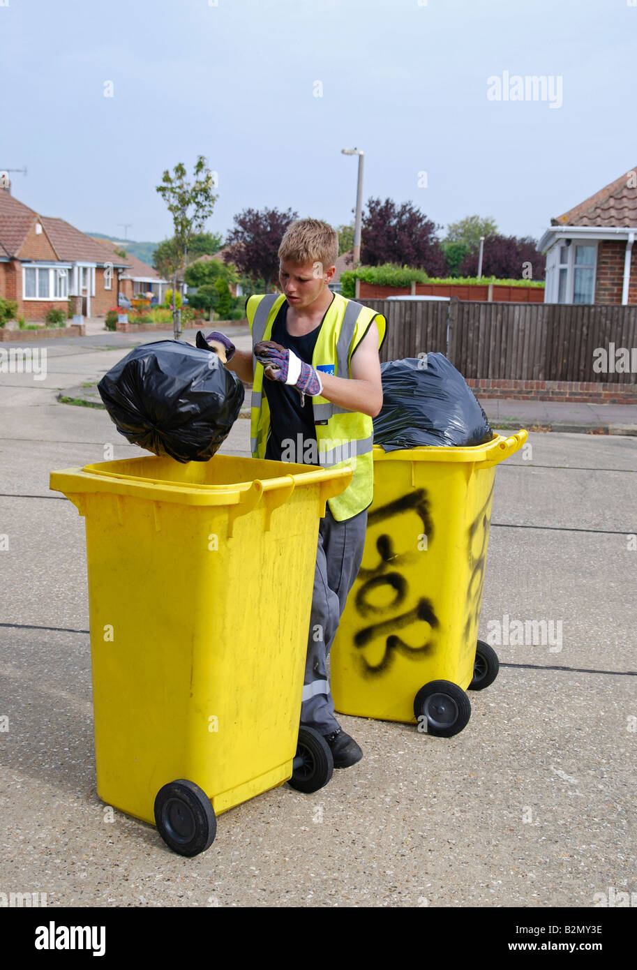 dustman colllecting rubbish for landfill Worthing Adur area West Sussex Stock Photo